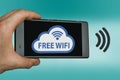 Free WIFI concept with hand holding mobile device Royalty Free Stock Photo