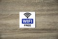 Free WiFi sign on wooden wall Royalty Free Stock Photo