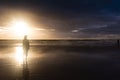 Free woman enjoying freedom feeling happy at beach at sunset. Beautiful serene relaxing woman in pure happiness and