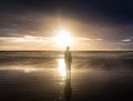 Free woman enjoying freedom feeling happy at beach at sunset. Beautiful serene relaxing woman in pure happiness and