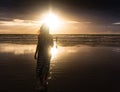 Free woman enjoying freedom feeling happy at beach at sunset. Beautiful serene relaxing woman in pure happiness and Royalty Free Stock Photo