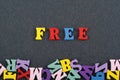FREE word on black board background composed from colorful abc alphabet block wooden letters, copy space for ad text. Learning Royalty Free Stock Photo
