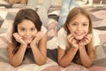 Free your smile. Little girls smile relaxing on bed. Happy children smiling. Dental care. Dentistry for kids. Keeping