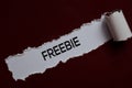 Freebie Text written in torn paper Royalty Free Stock Photo