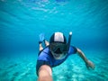Freediver young man taking selfie portrait underwater