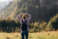 Freedom and active lifestyle concept. Adventure women making by hands in shape of love heart. Back view of Woman in Royalty Free Stock Photo