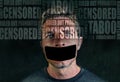 Freedom advertising composite with words like censored and taboo composed into face of young sad man with mouth sticky duct tape