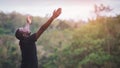 Freedom African man standing in nature forest and lake with smile and happiness.Concept about nature fertility and relaxation