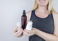 Girl holds in her hands three eco-friendly antiperspirants with natural ingredients. Refusal of antiperspirants containing toxic Royalty Free Stock Photo