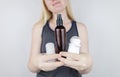 Girl holds in her hands three eco-friendly antiperspirants with natural ingredients. Refusal of antiperspirants containing toxic Royalty Free Stock Photo