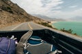 freedom backpacker girl with big backpack and travel hitchhiking growth in the back of a pickup truck