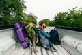 freedom backpacker girl with big backpack and travel hitchhiking growth in the back of a pickup truck