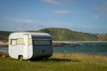 Freedom camping in caravan at an East Coast beach, Gisborne, North Island, New Zealand