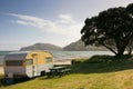 Freedom camping in caravans at an East Coast beach, Gisborne, North Island, New Zealand