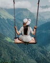 Freedom and carefree of a young female on a swing