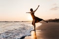 Freedom Chinese woman feeling free dancing at beach sunset. Royalty Free Stock Photo