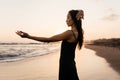 Freedom Chinese woman feeling free dancing at beach sunset. Royalty Free Stock Photo