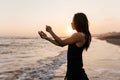 Freedom Chinese woman feeling free dancing at beach sunset. Royalty Free Stock Photo