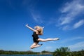 Freedom concept. Dancer jumping against blue sky Royalty Free Stock Photo