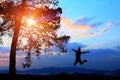 Freedom concept,silhouette women jumping happily in holiday,young teenagers recreation wiht adventure and camping Royalty Free Stock Photo