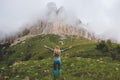 Freedom concept woman hiking in foggy mountains happy raised hands travel vacations Royalty Free Stock Photo