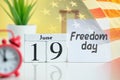 Freedom day america 19 nineteenth june Month Calendar Concept on Wooden Blocks