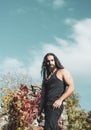 Freedom, feel good, travel and adventure concept. Stylish handsome macho man standing against sky and colorful ivy Royalty Free Stock Photo