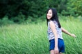 Freedom happy girl walking on the grass field Royalty Free Stock Photo