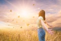 Freedom And Healthy a girl stretching her arms in the sun among the butterflies