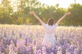 Freedom And Healthy a girl stretching her arms in the sun among the butterflies