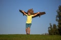 Freedom kids, boy playing to be airplane pilot, funny guy with cardboard wings as an airplane. Child pilot aviator with Royalty Free Stock Photo