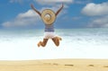 Freedom lifestyle of young man feeling a happiness woman jumping on beach in summer tropical Royalty Free Stock Photo