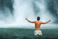 Freedom. Man Feeling Free With Hands Up Near Waterfall Royalty Free Stock Photo