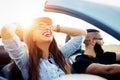 Freedom of the open road.Young Couple Driving Along Country Road In Open Top Car Royalty Free Stock Photo