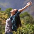 Freedom, peace and hands raised with young woman in garden of spring for enthusiasm or inspiration. Nature, smile and Royalty Free Stock Photo