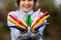 Freedom Seychelles concept. Cute child forming flying bird gesture with hands painted in Seychelles flag colors Royalty Free Stock Photo