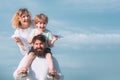 Freedom to dream - joyful boy playing with toys airplane against the sky - vintage effect. Happy father giving shoulder Royalty Free Stock Photo