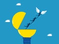 Freedom to find business knowledge. Businessman team leader flutters freely with wings out of a light bulb