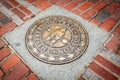 Freedom Trail brass marker implanted in city pavement of city