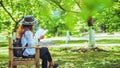 Freedom traveler woman sitting and reading in the The park and enjoying a beautiful nature. space for text