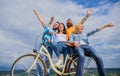 Freedom urban commuting. Company stylish young people spend leisure outdoors sky background. Bicycle as part of life Royalty Free Stock Photo