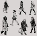 Freehand drawings of casual female pedestrians striding down street