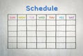 Freehand pen doodle sketch drawing of blank monthly grid timetable schedule on cement wall background