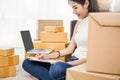 Freelance asian woman working with box at home concept