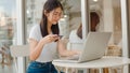 Freelance Asian women online shopping at coffee shop. Young Asia Girl using laptop, credit card buy and purchase e-commerce on Royalty Free Stock Photo