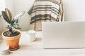 Freelance concept. Desktop with laptop, notebook, coffee cup an Royalty Free Stock Photo