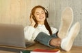 Freelance girl enjoys music in headphones, sun flare Royalty Free Stock Photo