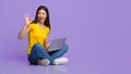 Freelance Jobs. Positive asian girl sitting with laptop and showing ok