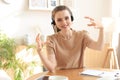 Freelance operator talking with headsets and consulting clients from home office Royalty Free Stock Photo