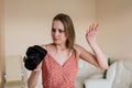 Freelance photographer woman with camera at home office editing photos on a computer Royalty Free Stock Photo